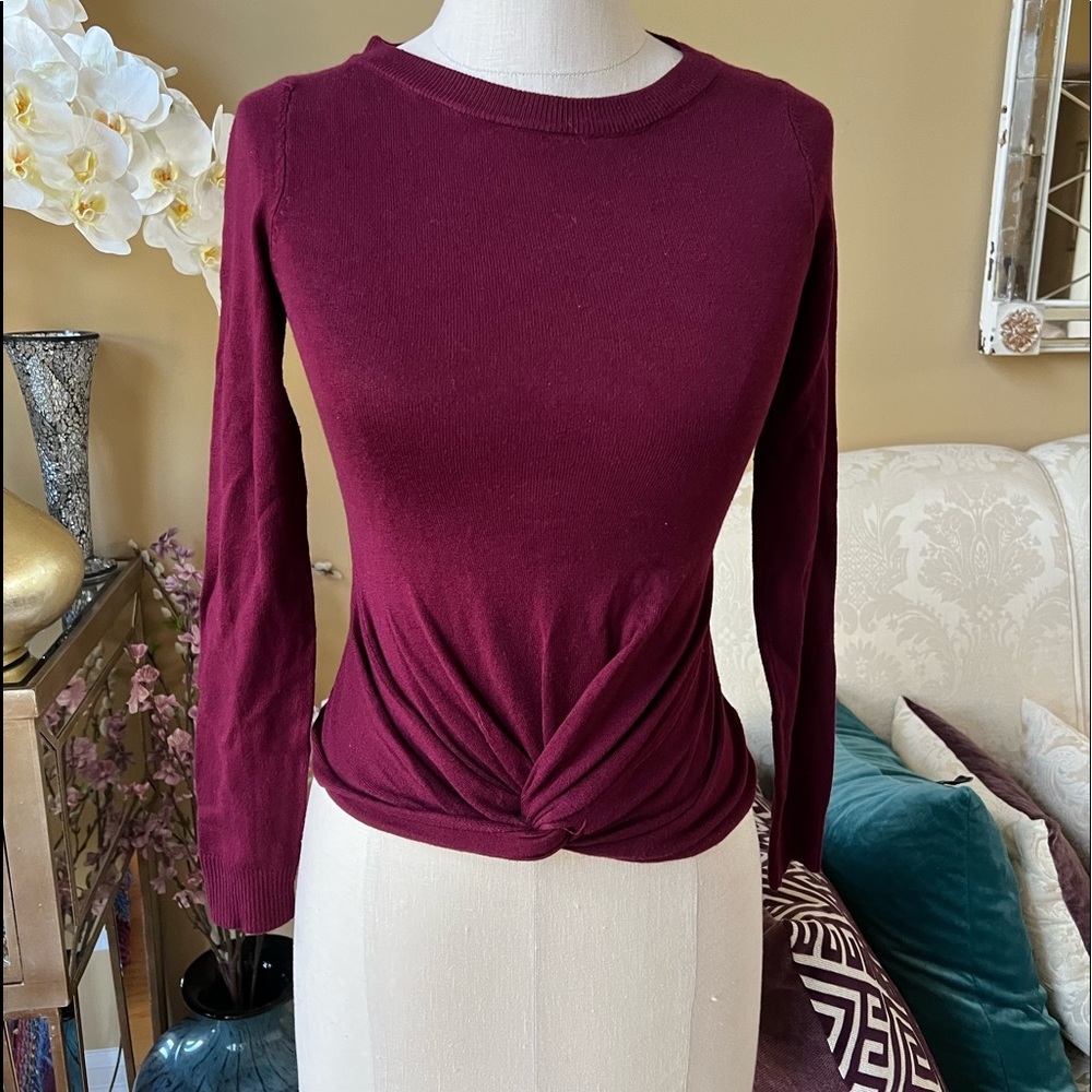 Debut burgundy sweater Size is labeled S/M. Sweater has stretch.